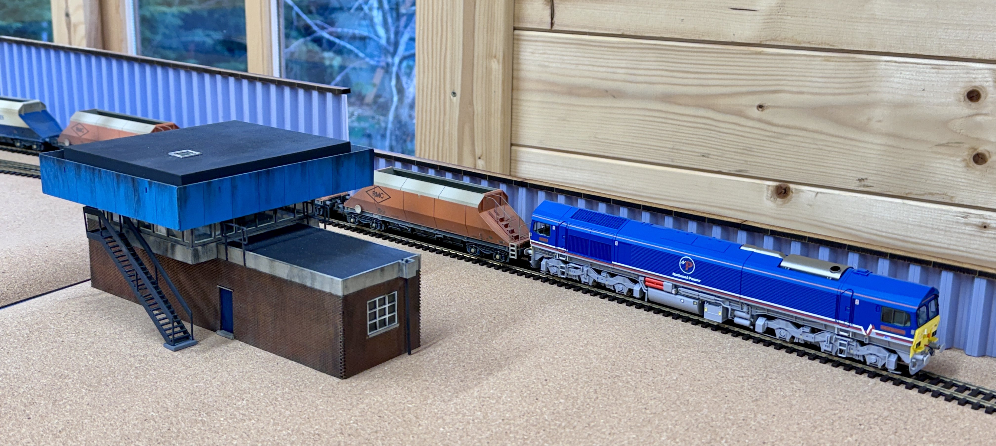 A Dapol Class 59 passes the location of the new signalbox on Topley Dale.
