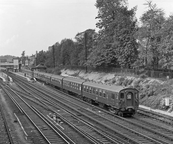 BR 4-CEP EMU 7153 leads two others in a 12-car formation as they depart Bromley South on the 11.40 Victoria to Ramsgate service on October 14 1959