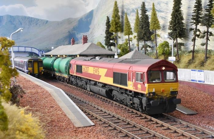 A Class 66 pauses at Tulloch Bridge with a fuel oil train.